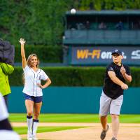 Individual throwing pitch at Comerica Park event